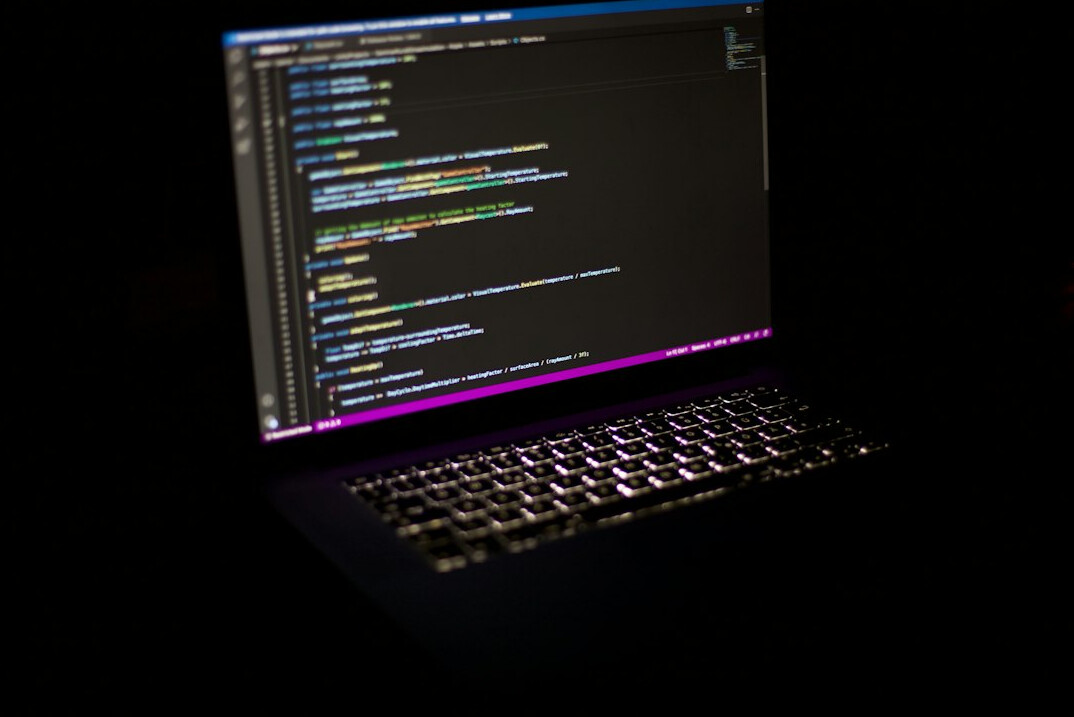 laptop with code on screen