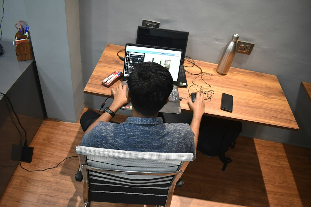 beginner coder at desk